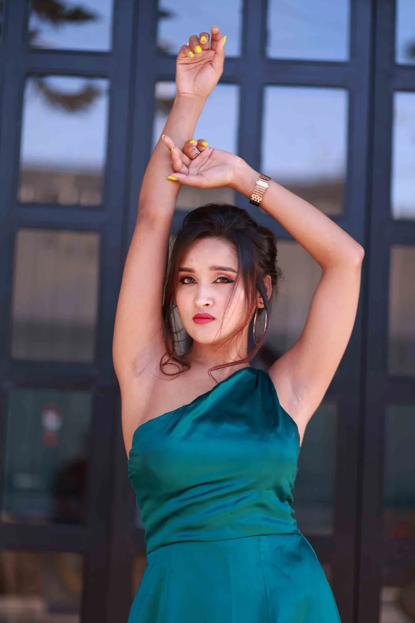 Teal one-shoulder gown — dramatic editorial pose